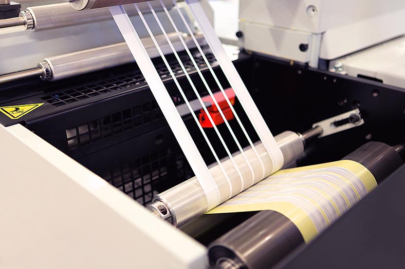 Image of a flexographic press running with a die line.